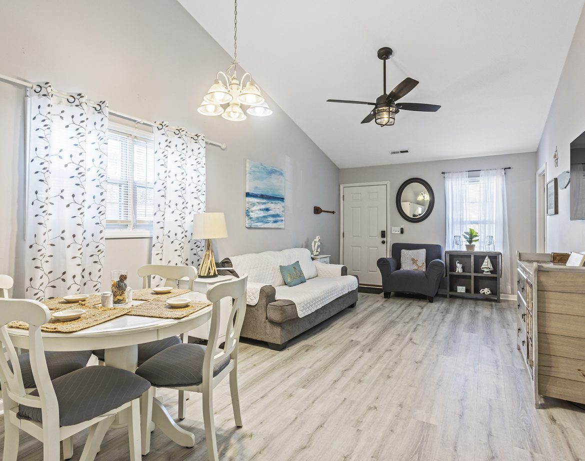 Master bedroom with elegant beach-themed decor.