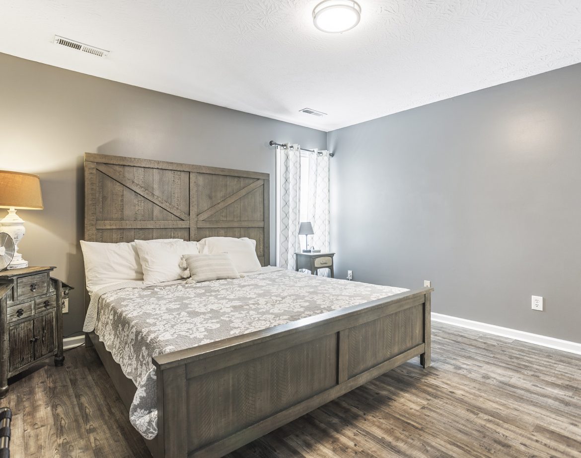 Pet-friendly vacation rental with a happy dog in the yard.