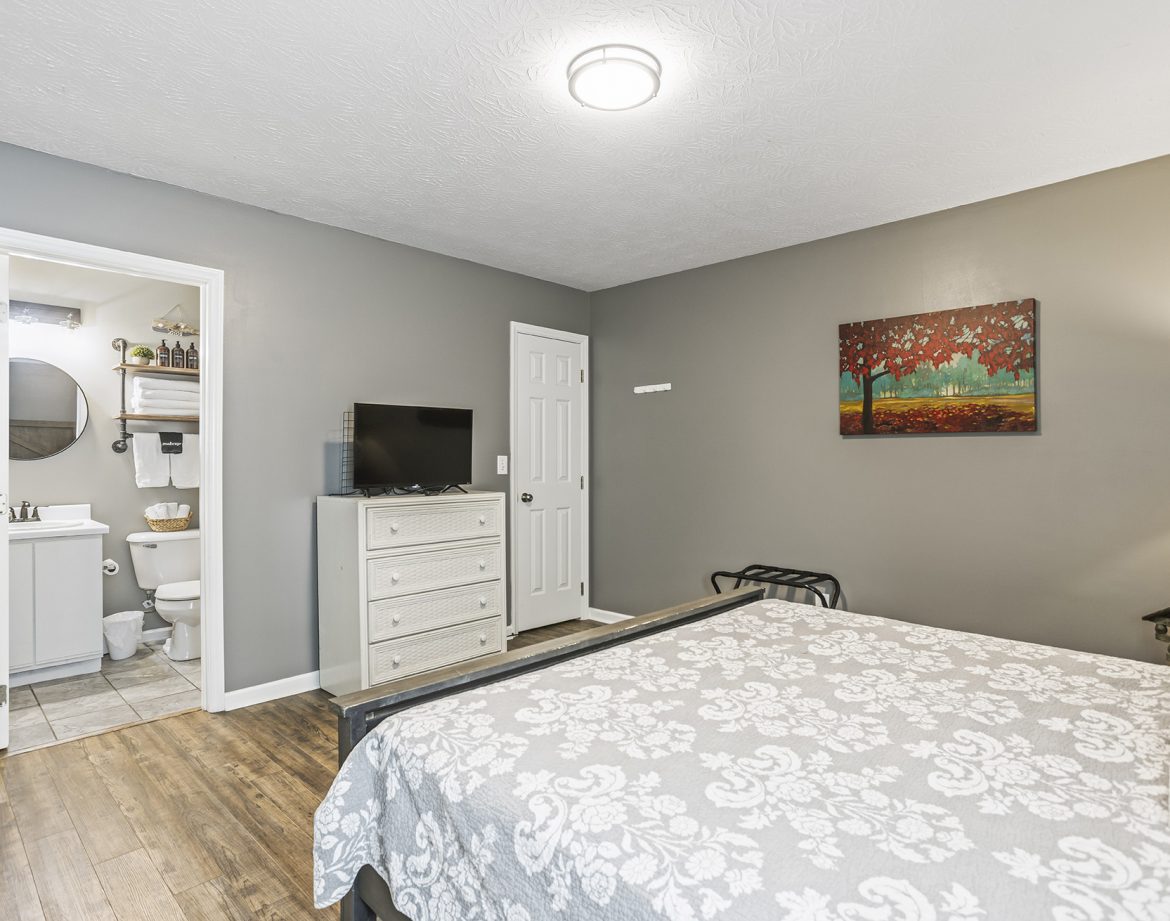 Children playing with beach toys by the shore.