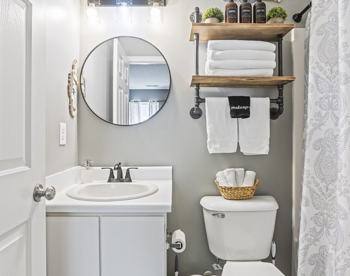 Family enjoying a barbecue in the fenced-in yard.